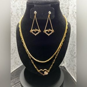 18” Necklace with heart pendant and chain extender. A pair of heart earrings.